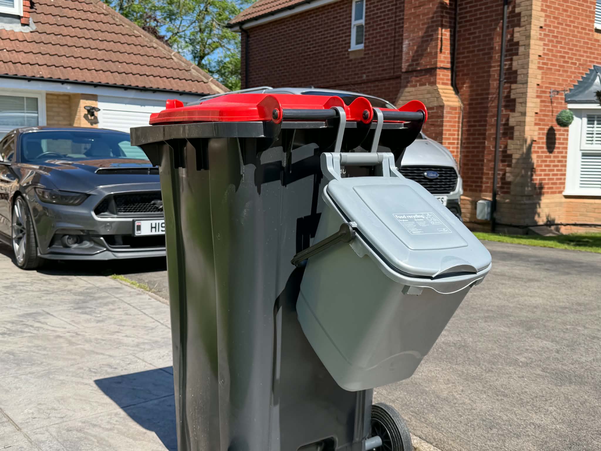 3D printed Food Waste Bin Hook holding a caddy on a wheelie bin